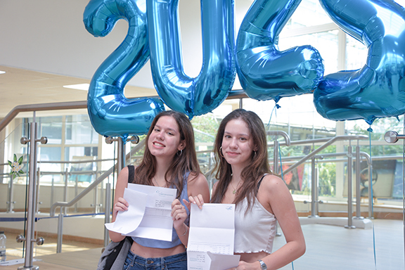 Twinning! Top Twins Meriona (pictured left) (AAA) and Edma (AAA) How do you feel today? Edma: Ecstatic! Itâs the opposite of anti-climatic, whatever that is! Opening my envelope was such a happy surprise for me â I had read a lot about how the grades would be different to last year so I was worried. Meriona: I feel really happy that I was able to make my teachers proud. And we both got the same grades so thereâs no competition! What are your future plans? Together: Going to Southampton University! Edma: Iâm studying Accounting and Finance. Meriona: Iâm studying Business Management. What has been your greatest challenge this year? Edma: Going to school early, as Iâm definitely not a morning person! Also, I donât recommend getting a job whilst youâre studying for your A Levels; I found it hard to juggle work and revision. Meriona: The same as her â waking up early! We have to travel quite a long way to come here as we are external students; the transition here from Year 11 was seamless, though. The students and staff are so friendly. What advice would you give to students in Year 11/12 about getting through the A Level years? Meriona: Have fun and try to make as many memories as you can. Edma: Donât fall behind. Say yes to every opportunity youâre given, like trips and extra-curricular activities. What is the best thing about The Compton Sixth Form? Edma: Everything! Honestly, I would recommend this Sixth Form to everyone.  BTEC Success: Hirbod (Distinction*, Distinction, B) and Andreas (Distinction*, Distinction*, C â pictured with his Accounting and Finance teacher Mr Spitz) How do you feel today?  Hirbod: Iâm pretty happy that my hard work paid off.  What are your future plans? Hirbod: Iâm heading to Southampton to study Financial Technology; I want to be an investment banker. Andreas: Iâm starting an Accounting trainee apprenticeship for ACCA Chartered Accounting. Iâll work Monday-Friday and they will give me time off to study and sit exams.  What has been your greatest challenge this year? Hirbod: I found Maths difficult and the language barrier for me was a challenge â my first language is Farsi. Iâm really proud of the results that Iâve got! What advice would you give to students in Year 11/12 about getting through the A Level years? Hirbod: Honestly, just work hard from the very beginning â donât slack off! Andreas: Do your research about Higher Education options â you donât always have to go to university after your A Levels. I chose the apprenticeship over university as money motivates me; Iâll start on Â£20,000 in September. Also, for the profession I want to enter, Iâll get better qualifications with the ACCA and I can gain good experience whilst working. What is the best thing about The Compton Sixth Form? Hirbod: The teachers are so helpful.  Future Doctors Ken (pictured left) (AAA) and Ashagan (A*AAA) How do you feel today? Ken: Overwhelmed; itâs just an accumulation of everything really. Ashagan: Relieved. I felt really nervous and anxious before. What are your future plans and will you miss each other!? Ken: Iâm going to apply to study Medicine through clearing; Iâm not going to give up and Iâm going to give it everything. Ashagan: Iâm either studying Medicine through clearing or taking a gap year. What has been your greatest challenge this year? Ken: Just maintaining that constant dedication and keeping motivated. Iâve realised that not everything is easy to learn and remember. Ashagan: Facing the rejection from university but Iâm determined to succeed. What advice would you give to students in Year 11/12 about getting through the A Level years? Ken: Make sure that you do the hard work early. Dedication and self-discipline are really important. Ashagan: Make sure that you are studying subjects that you enjoy. What is the best thing about The Compton Sixth Form? Ken: The support from teachers here. At other colleges, I just donât think that you get the interaction or the chance to build the rapport with your teacher like you do here. Your teacherâs energy and enthusiasm creates your passion for the subject and itâs really make or break with that. All my teachers here are amazing. Ashagan: Honestly, just the same as him!   Clio(pictured right) (A*AB) and Marriam (A*A*A*) Top Achieving External Students  How do you feel today? Marriam: Good â I did A Levels for three years as I had to retake Year 12; it was hard but Iâm so pleased with the results. Clio: Numb, but in a really happy way! I have a heavy, happy feeling in my heart. What are your future plans? Marriam: Iâm going to Manchester to study Mechanical Engineering. Clio: Iâm still thinking about my next steps. What has been your greatest challenge this year? Marriam: COVID was really challenging and I had to learn to work for independently. Compton has really supported me with this. Clio: Just coping! Itâs hard to navigate things that I donât understand. What advice would you give to students in Year 11/12 about getting through the A Level years? Marriam: If you find yourself in a position like I was at the end of Year 12 where youâre not happy with your subjects or your grades, know that itâs okay to retake. It really doesnât affect your life in any negative way and, if anything, it boosts your confidence. Speak to your teachers about what is right for you. Clio: Youâre not crazyâ¦it is hard work! Try to manage all of Year 12 before you start Year 13 and donât leave any gaps in your knowledge. Always catch up. What is the best thing about The Compton Sixth Form? Marriam: The teachers have helped me so much, not just with work but with personal struggles too. I was given a new start here after attending a different Sixth Form and I can honestly say that Compton is the best â itâs the most supportive.  High Achieving Girls Anahita (pictured right) (A*AA) and Riya (A*AA)  How do you feel today? Anahita: I feel great â Iâve got the butterflies in my stomach and everything! Canât quite categorise the emotions. Riya: I feel good â so much relief. Honestly, I felt so nervous I was going to throw up! What are your future plans? Anahita: Iâm reading Law at Bristol University â Iâm not sure now whether to be a solicitor or not! Riya: I am going to study Bio Medicine at St Georgeâs â Iâm going to train to be a doctor. What has been your greatest challenge this year? Anahita: I found History challenging this year â Iâve just tried to not let the pressure get to me. Itâs a growth thing â I feel like Iâve grown over the past two years. Riya: I felt luck because we still had lessons when there was isolation and COVID happening to I donât feel like that;s impacted my learning. I wish I didnât worry and stress as much as I have done. What advice would you give to students in Year 11/12 about getting through the A Level years? Riya: Make the most of your free periods and actually revise! Anahita: Always pick courses that you enjoy doing. Know that itâs temporary; it will end. What is the best thing about The Compton Sixth Form? Riya: The people â you make so many new friends here. Anahita: The teachers â itâs different in Sixth Form and you form excellent relationships with your teachers; they are so supportive of you here.